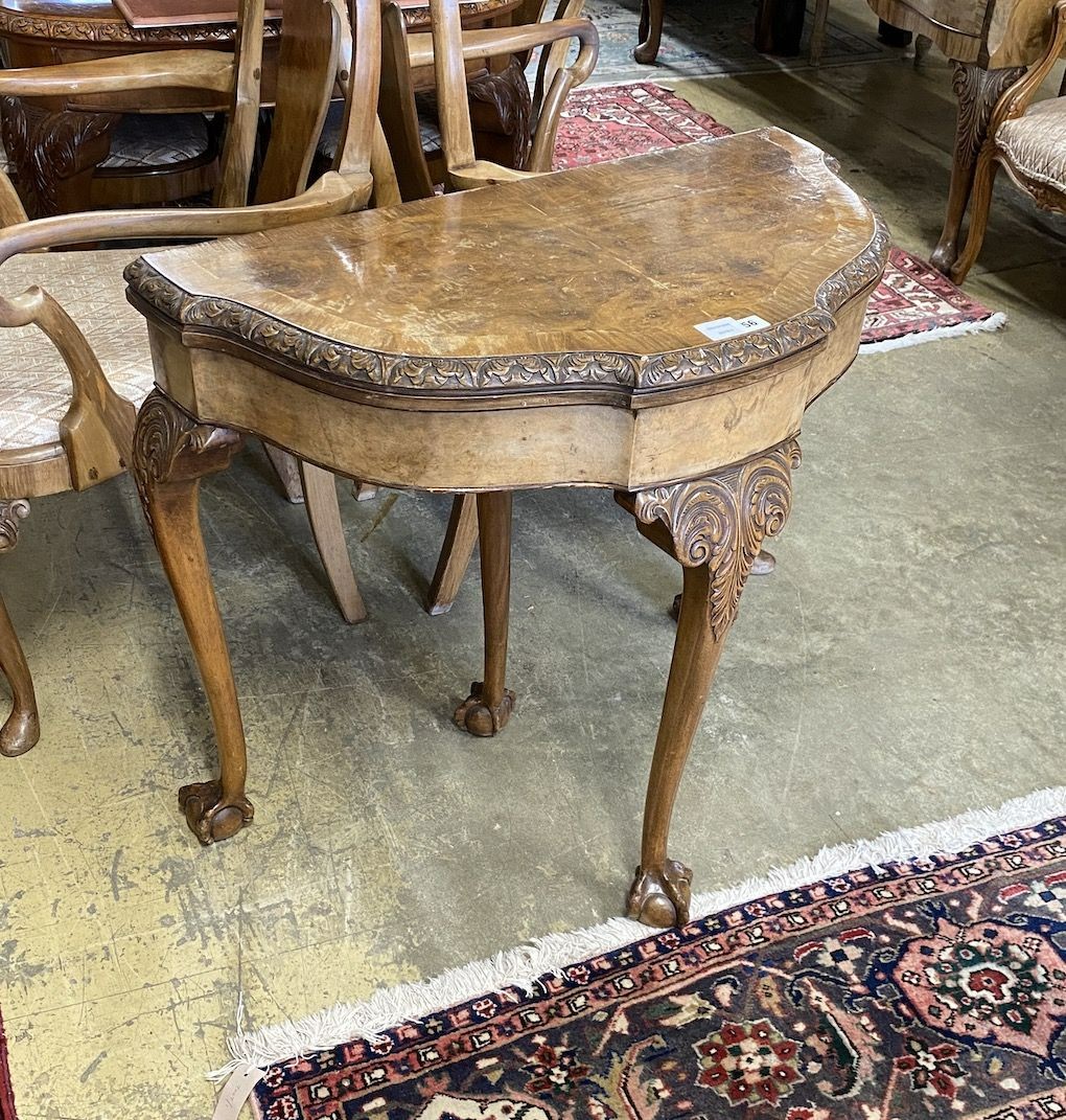 A Queen Anne revival burr walnut D shaped folding card table, width 83cm, depth 43cm, height 77cm